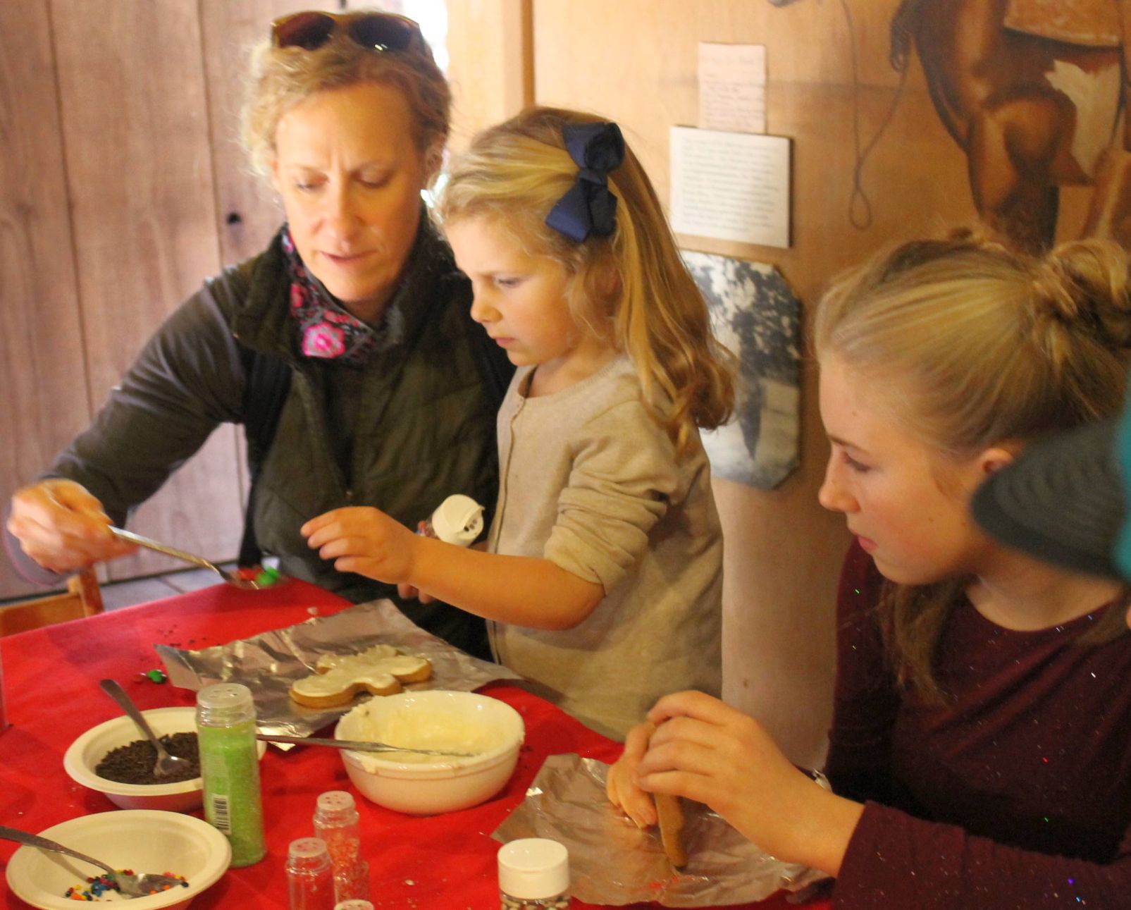 Dressing up a gingerbread man at Pioneer Christmas in the Bale Mill